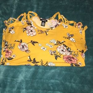 flower shirt cuts in the shoulder